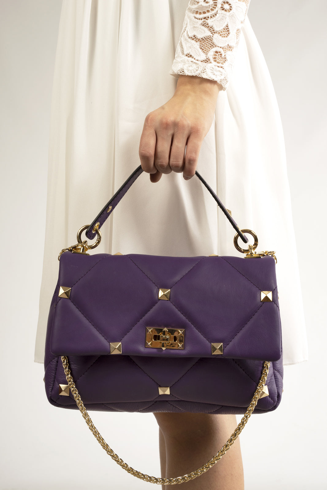 "Quilted full-grain leather bag with stud embellishments – Italian craftsmanship and elegance."