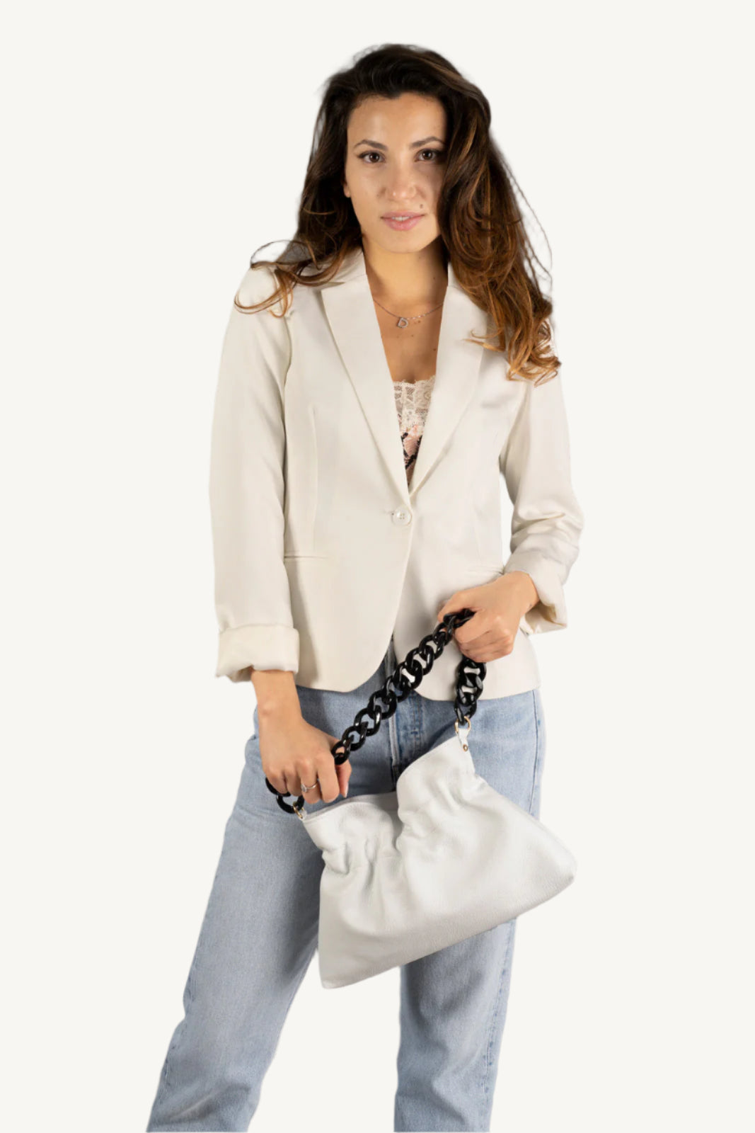 "Soft and slouchy top handle shoulder bag with elegant chain strap, zip closure, and interior zip pocket. Fashionable and functional."