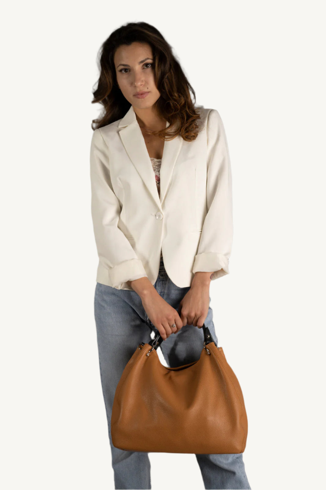 "Elegant women’s grain leather handbag with two top handles and gold detailing."