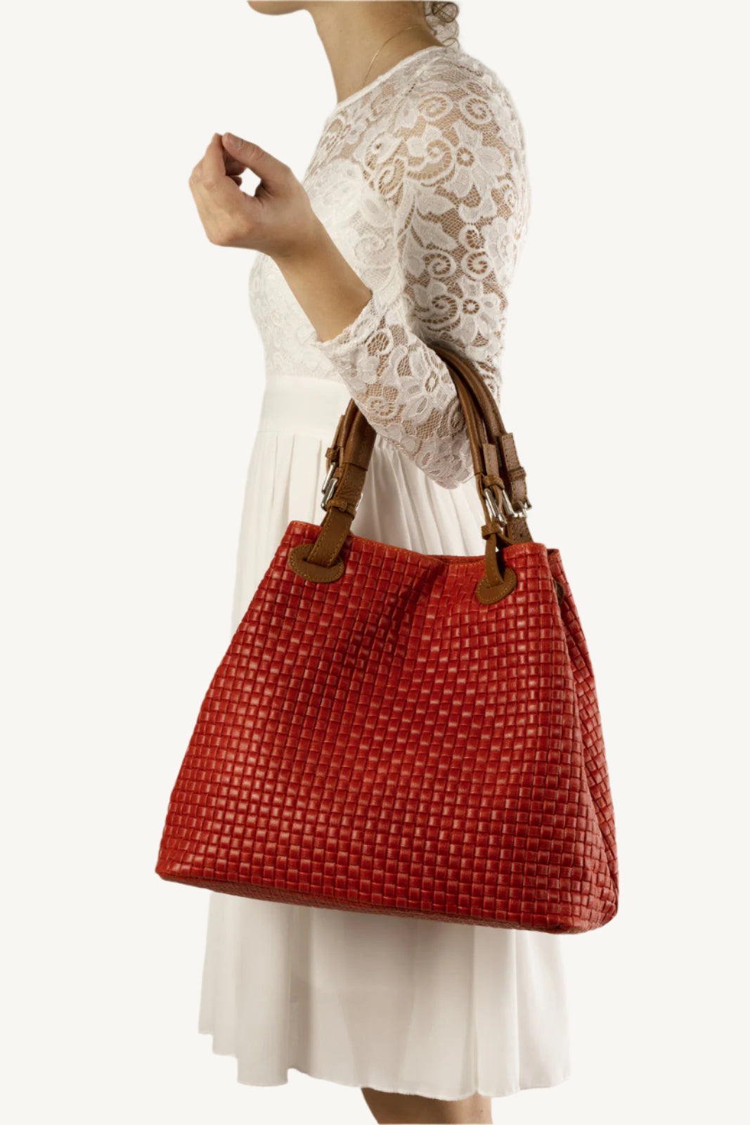 "Elegant woven suede handbag with top handles and adjustable shoulder strap – perfect for daily use."