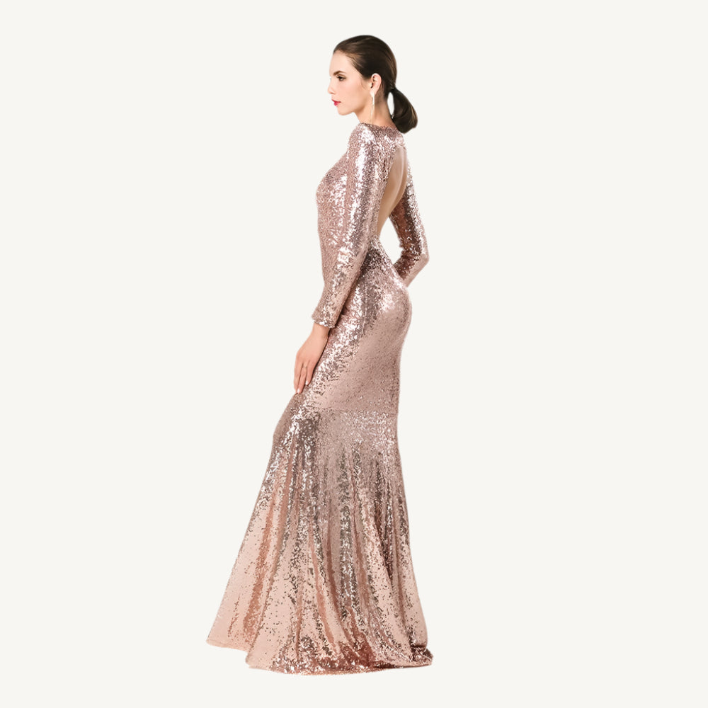 Gold Sequin Ball Gown, a dazzling and elegant dress adorned with shimmering sequins, perfect for making a glamorous entrance at any formal event. Featuring a voluminous skirt and fitted bodice, this gown exudes luxury and sophistication.