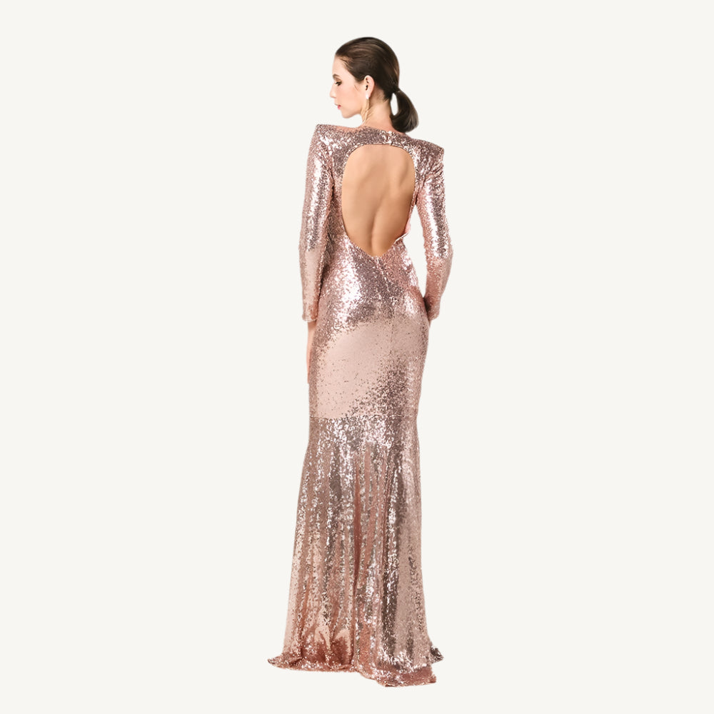 Gold Sequin Ball Gown, a dazzling and elegant dress adorned with shimmering sequins, perfect for making a glamorous entrance at any formal event. Featuring a voluminous skirt and fitted bodice, this gown exudes luxury and sophistication.